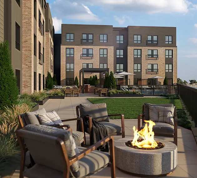 fire pit surrounded by lounge chairs
