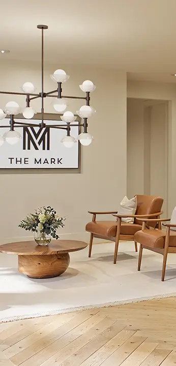 resident clubhouse featuring a modern light fixture and lounge seating